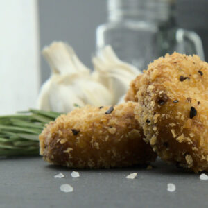 nuggets 2 Kartoffelpüree Nuggets vor Hintergrund